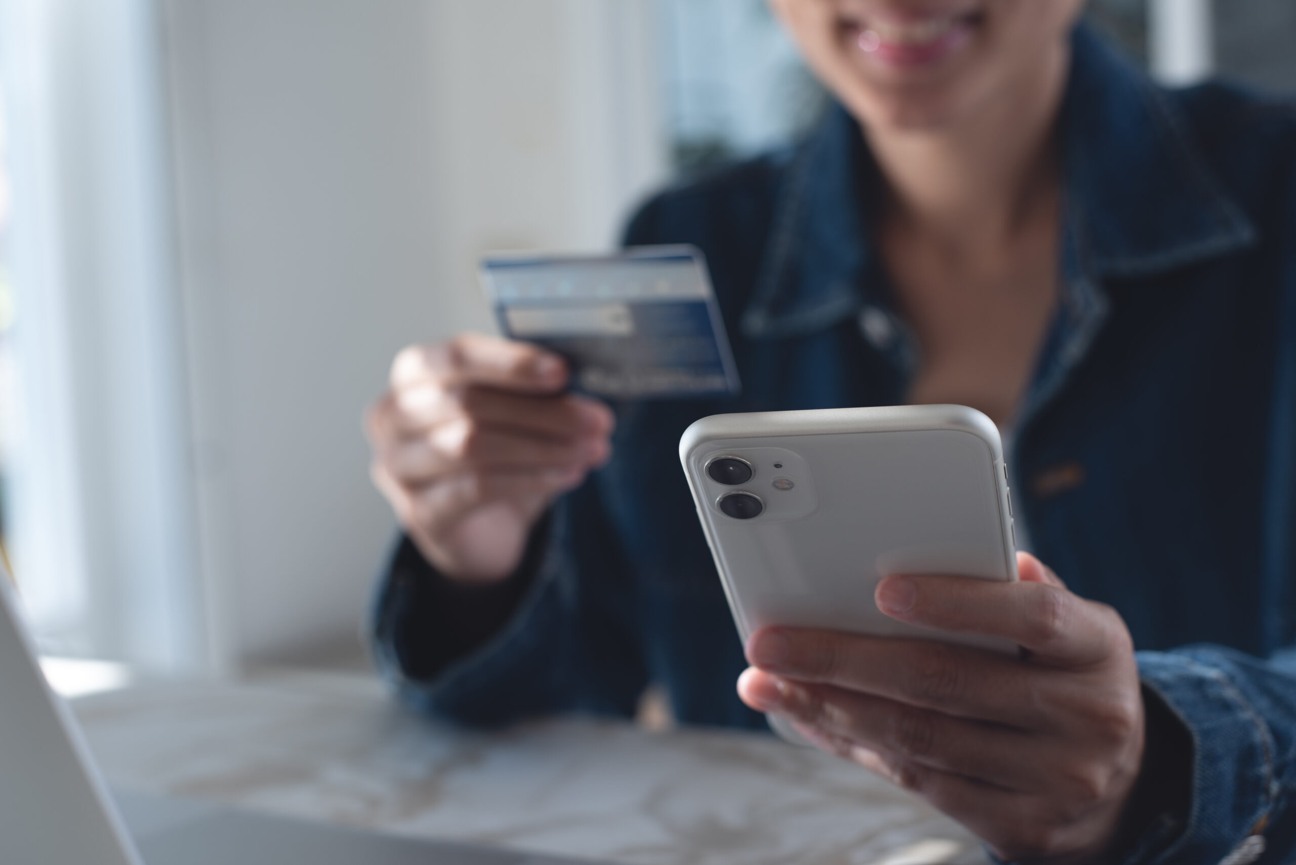 close up of woman using credit card and mobile smart phone for digital banking and online shopping via mobile app at home, smart banking, internet payment, business and technology, e commerce